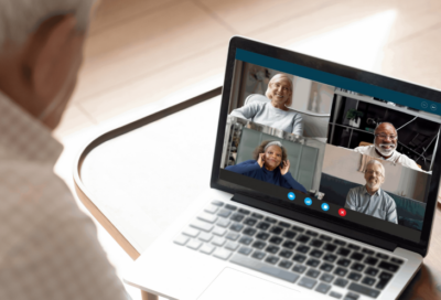man with laptop participates in web conference
