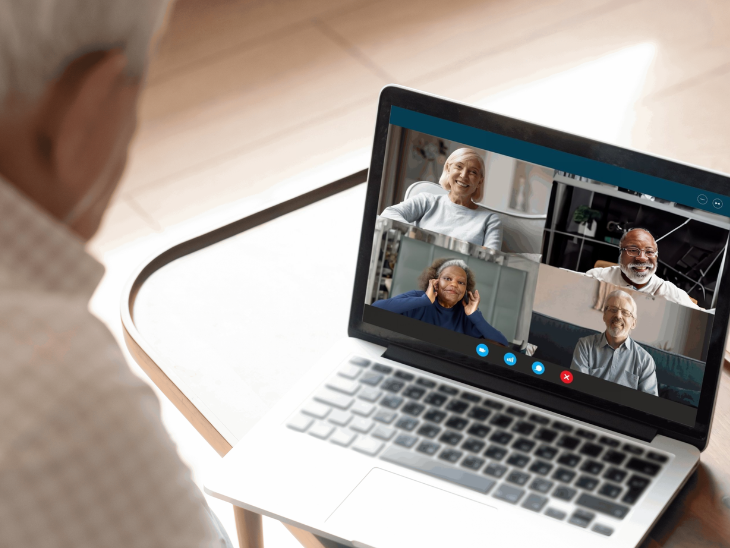 man with laptop participates in web conference