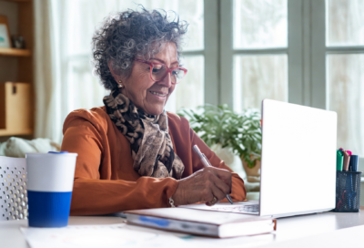 woman uses laptop to join webinar