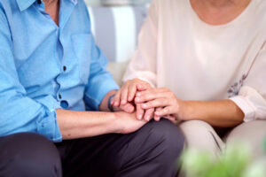 hands caringly embrace other hands