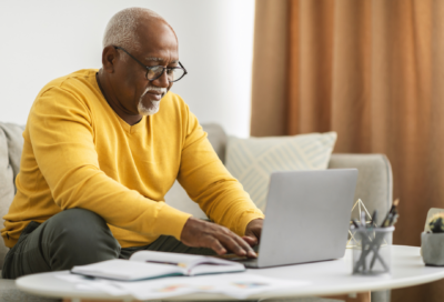 Man using laptop on coffee table