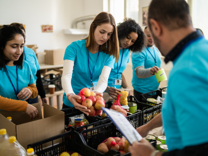 volunteers sort food donations